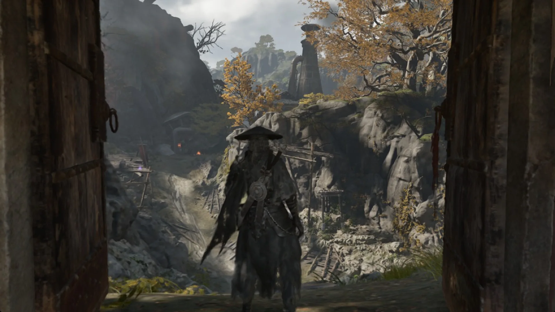 Soul in a doorway looking out over cliffs and autumn trees in Phantom Blade Zero