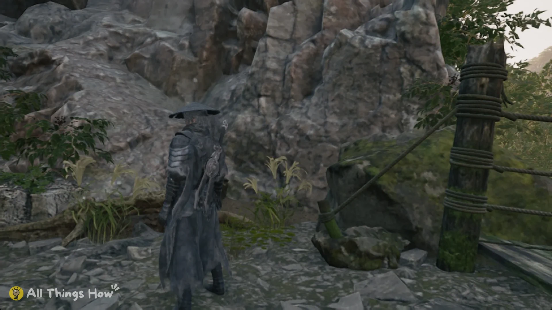 Soul beside a rope-bound post on a rocky mountain trail in Phantom Blade Zero