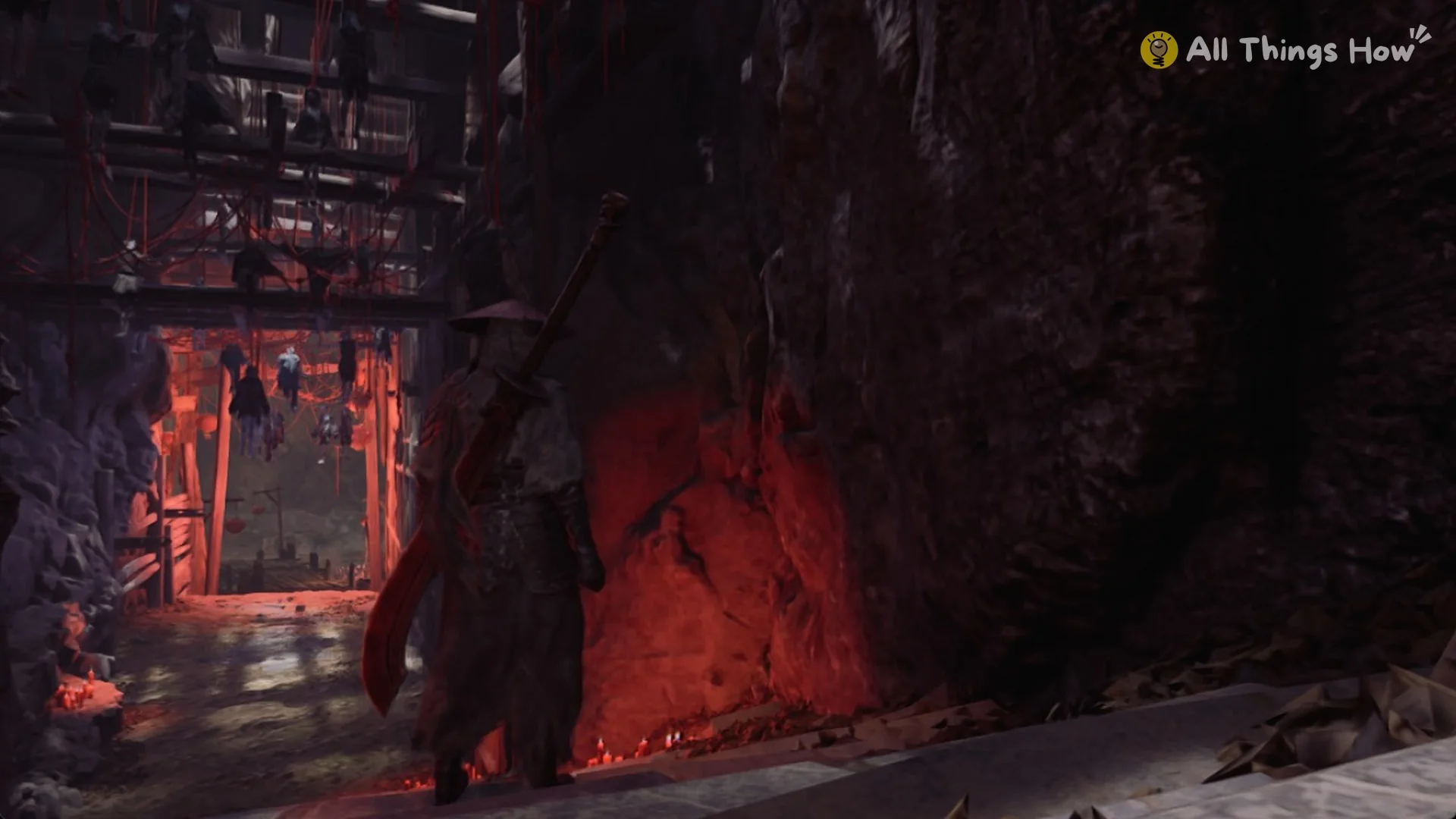 The sloped path past a red-lit rock wall, Phantom Blade Zero