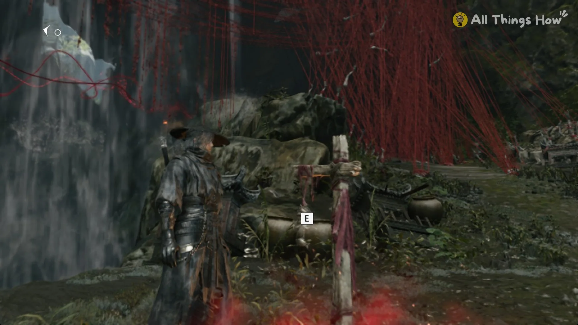 The curtain of red threads beside the Red Thread Barrier bell in Phantom Blade Zero