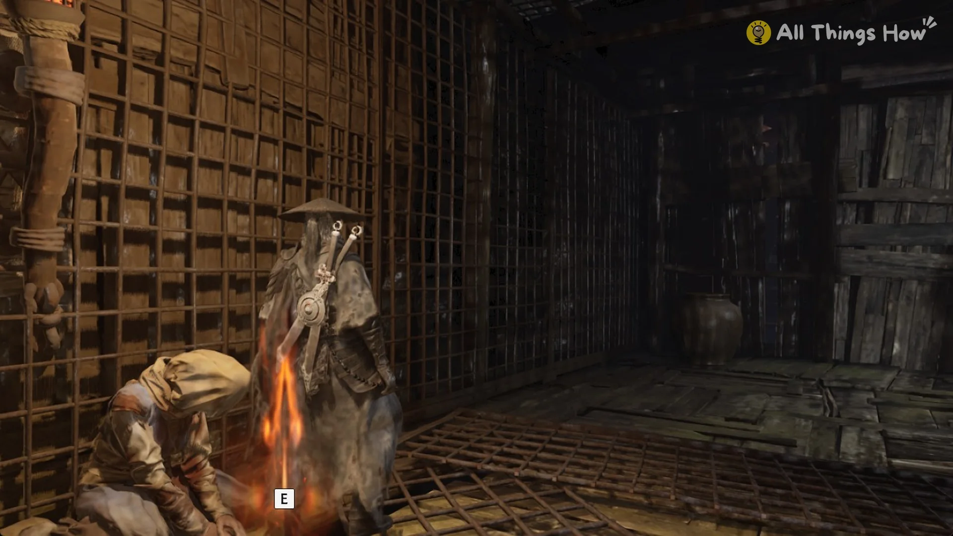 Dead Baishan disciple slumped against a lit brazier with the E prompt in Phantom Blade Zero