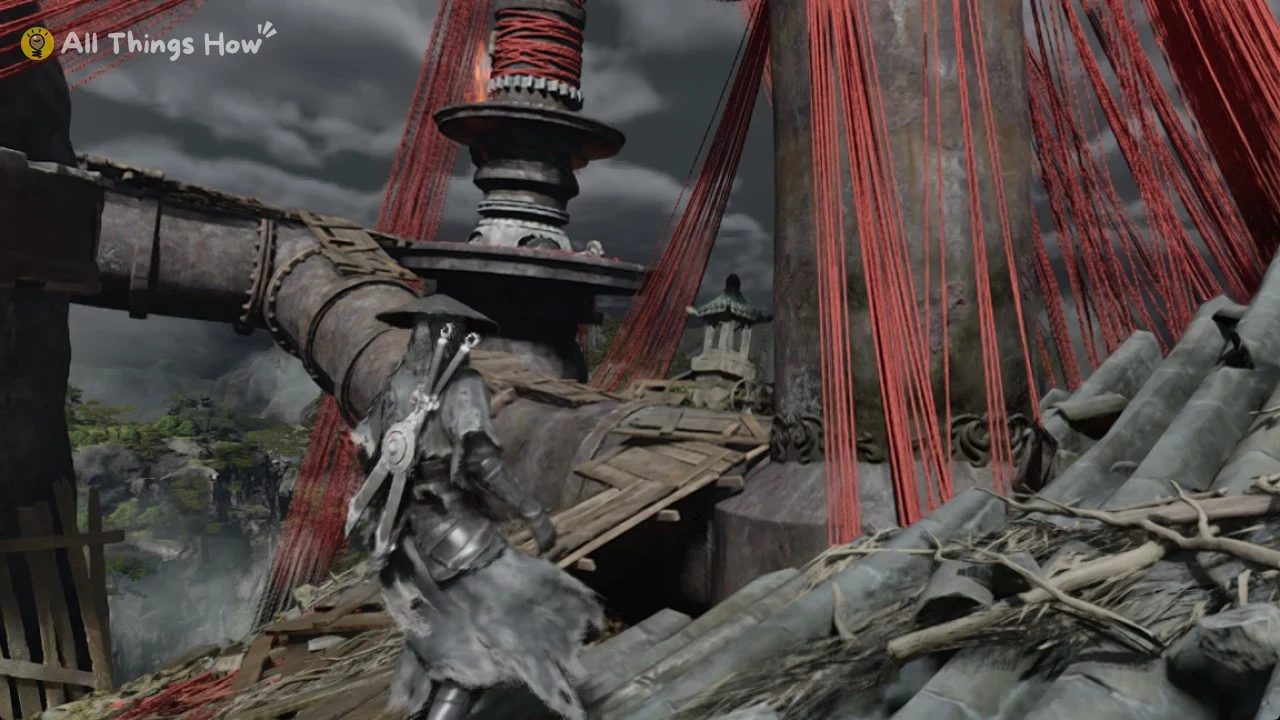 Soul seen from behind facing a rusted pipe with wooden planks, a tiered tower and hanging red threads.