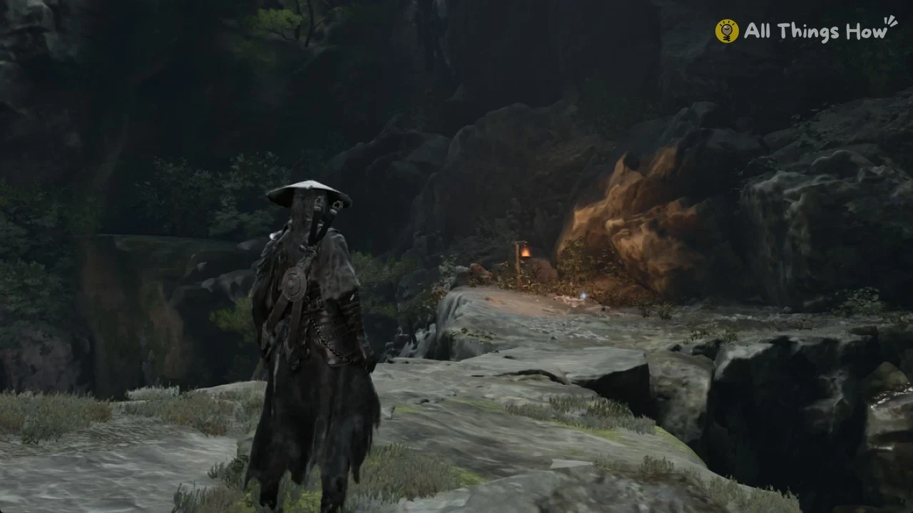 Stone path leading to the lantern and orange-lit rock where Solvent lies in Phantom Blade Zero