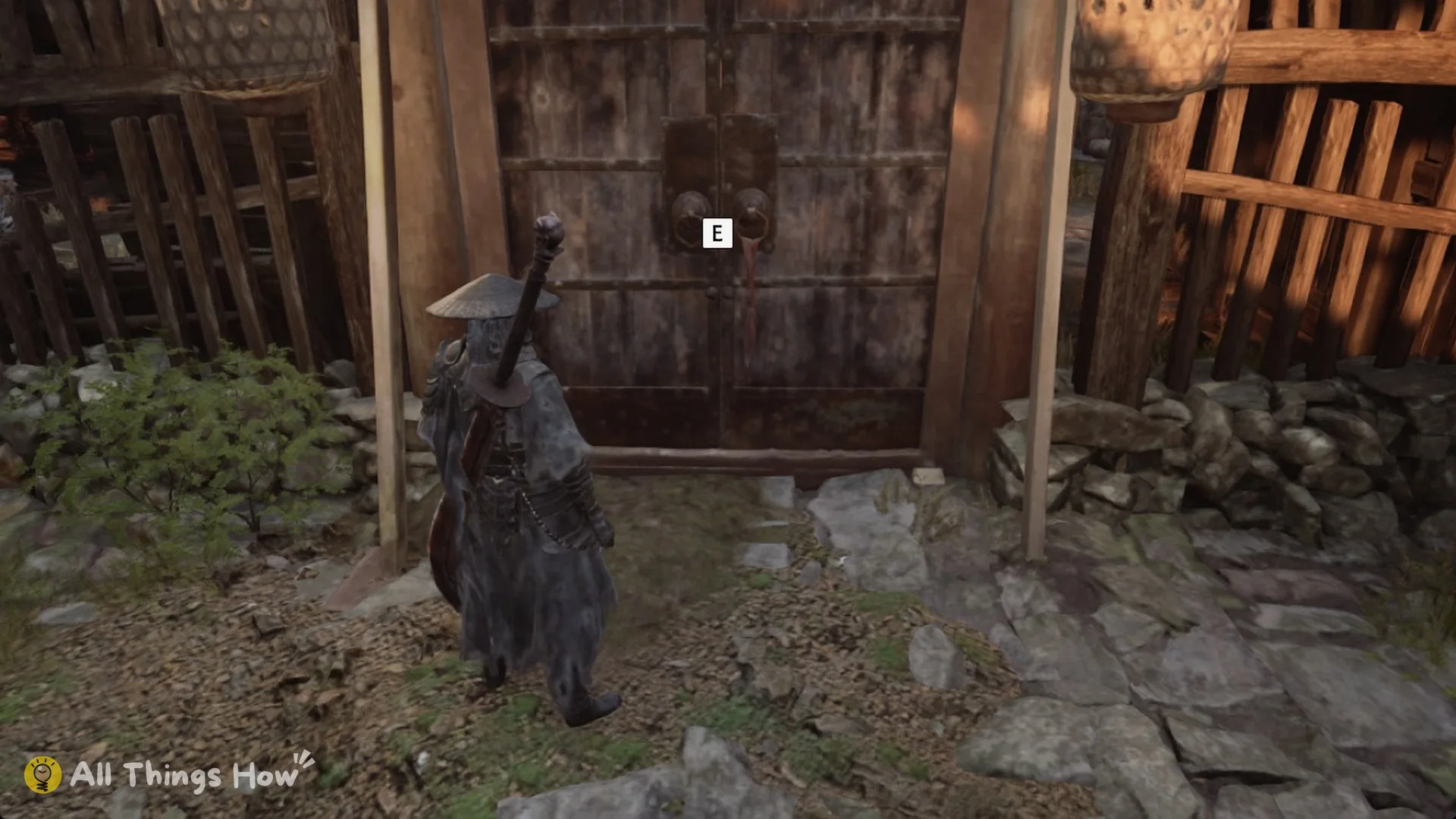 The double wooden gate of the Survivors' Courtyard with the E prompt, Phantom Blade Zero