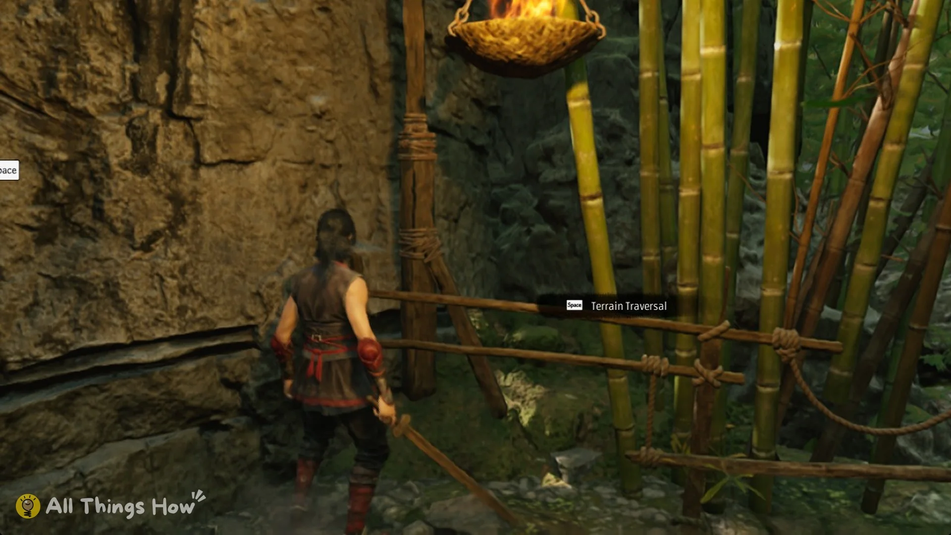 The Space Terrain Traversal tutorial prompt beside a burning fire basket in the Phantom Blade Zero prologue