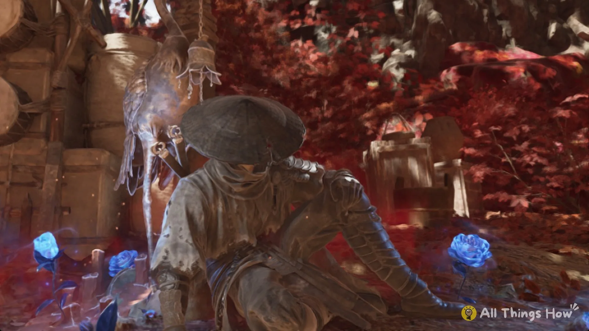 Soul sitting at the Thieves' Camp bell with blue flowers blooming around him in Phantom Blade Zero