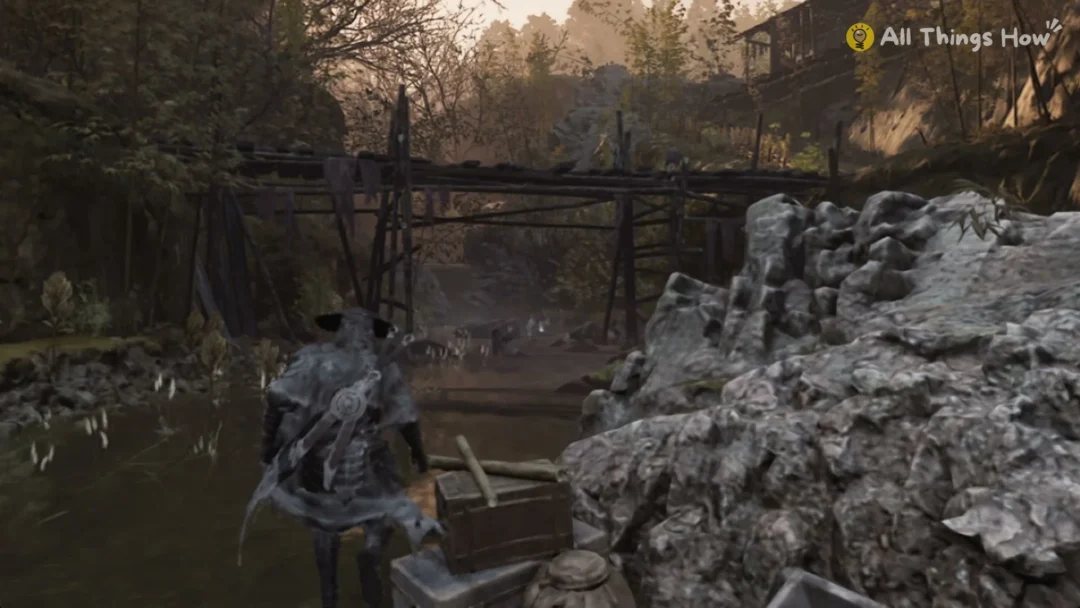 Soul wading up the stream past rocks and a wooden trestle in the Village of Lu, Phantom Blade Zero
