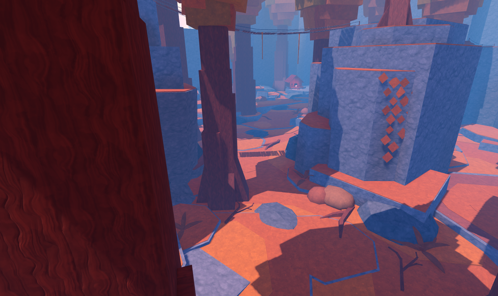 A stylized forested rocky area with large trees, stone formations marked with orange diamonds, and cables strung overhead