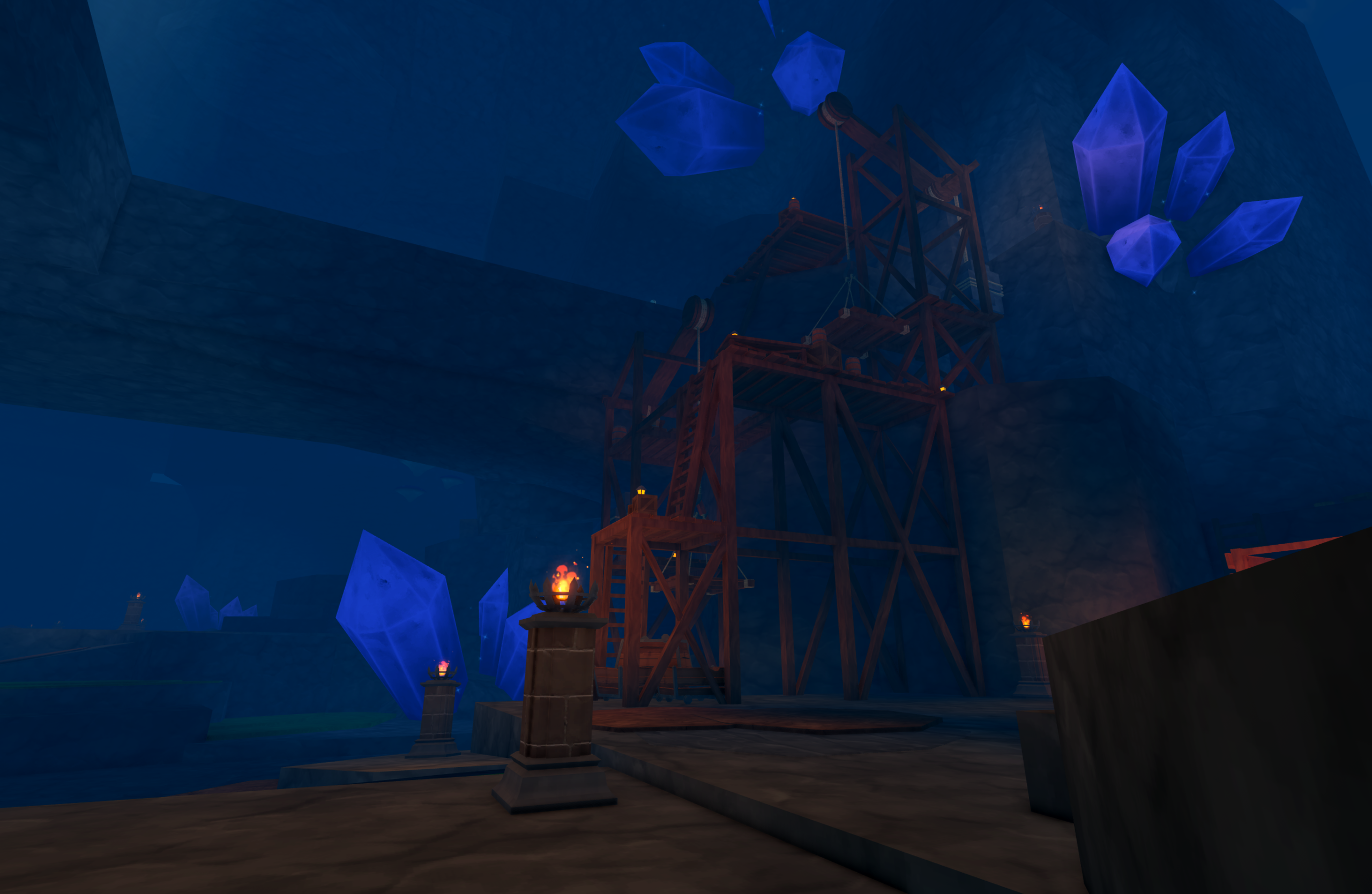 A wooden mining scaffold with ladders and platforms stands inside a dark blue cave