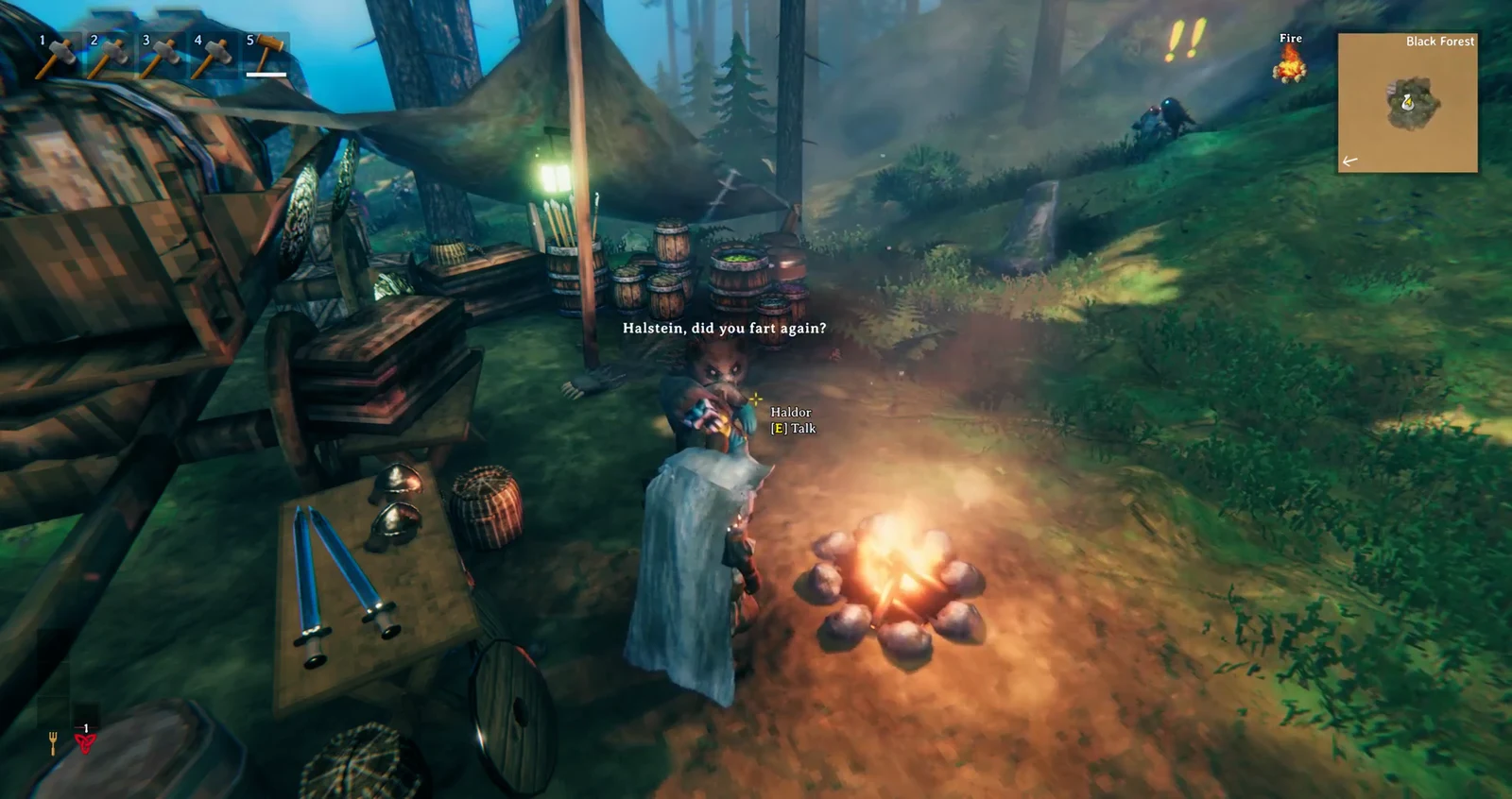 Haldor beside his campfire with the E Talk prompt highlighted as the player approaches.