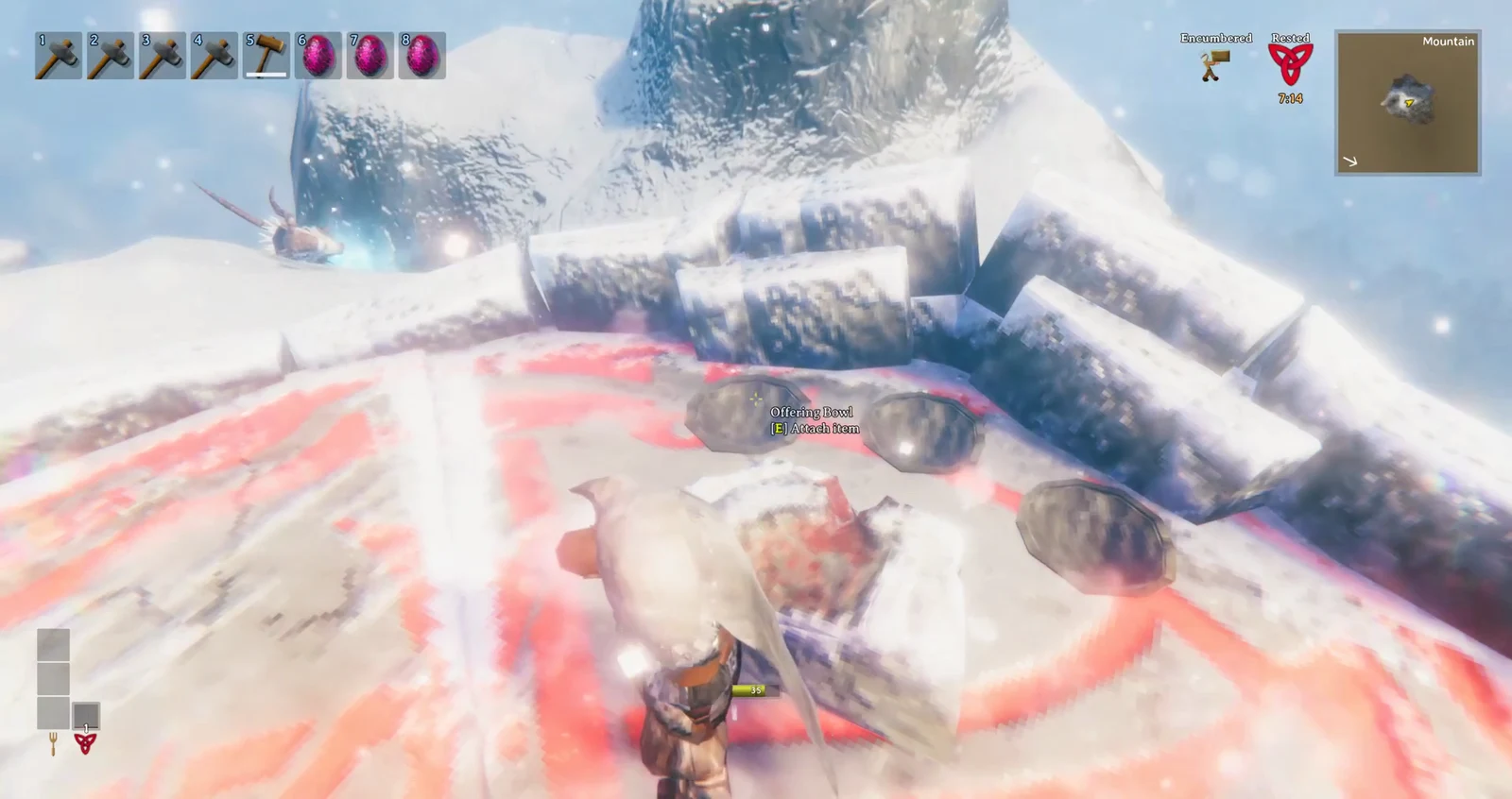 The Offering Bowl interaction prompt showing E to attach item at the snowy Mountain altar