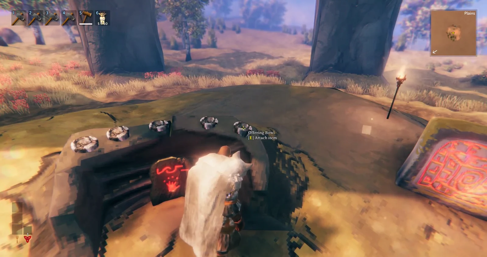 Targeting an Offering Bowl with the E Attach item prompt to place a Fuling Totem