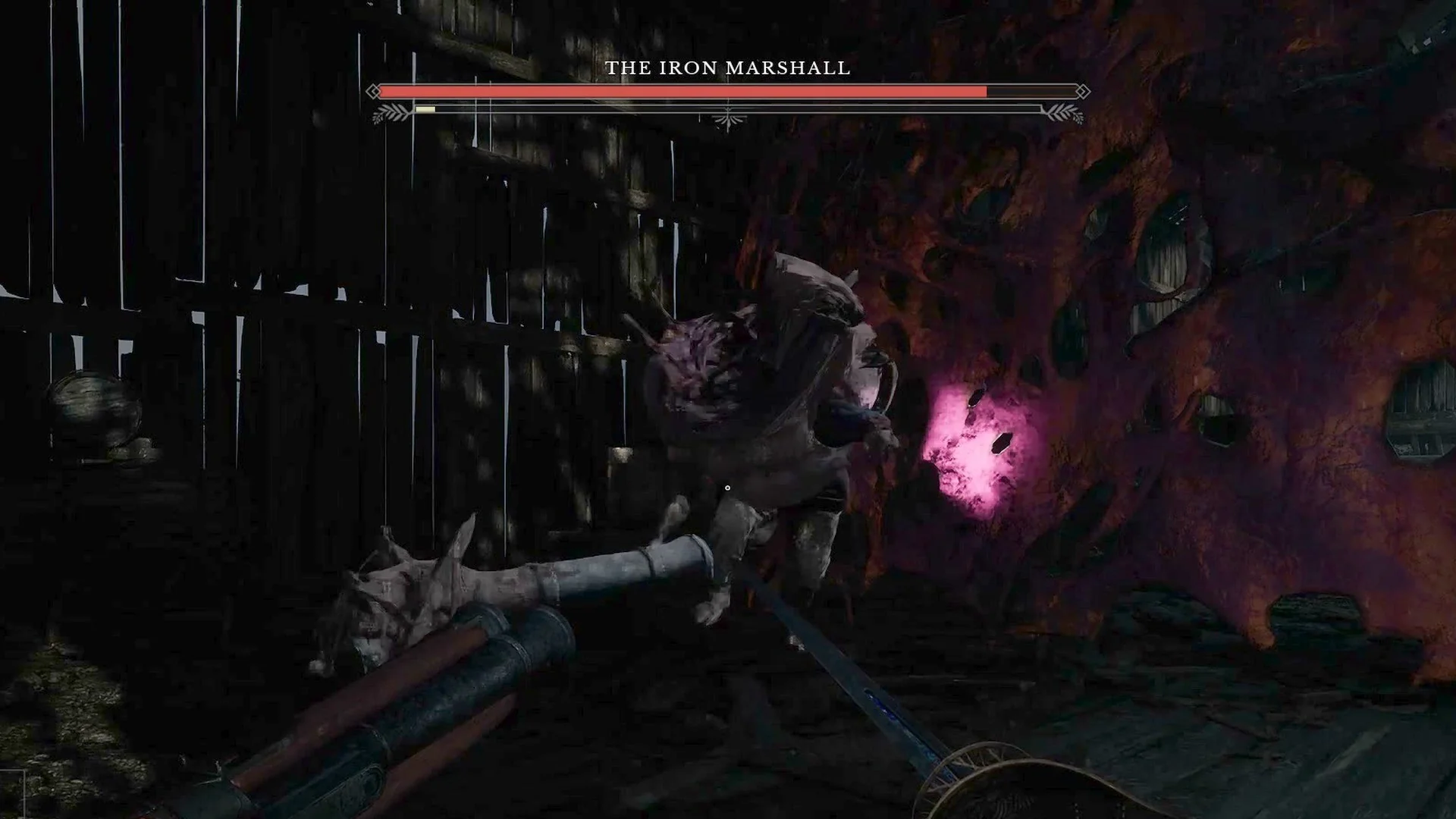 The Iron Marshall levelling his cannon arm, with a pink muzzle flash