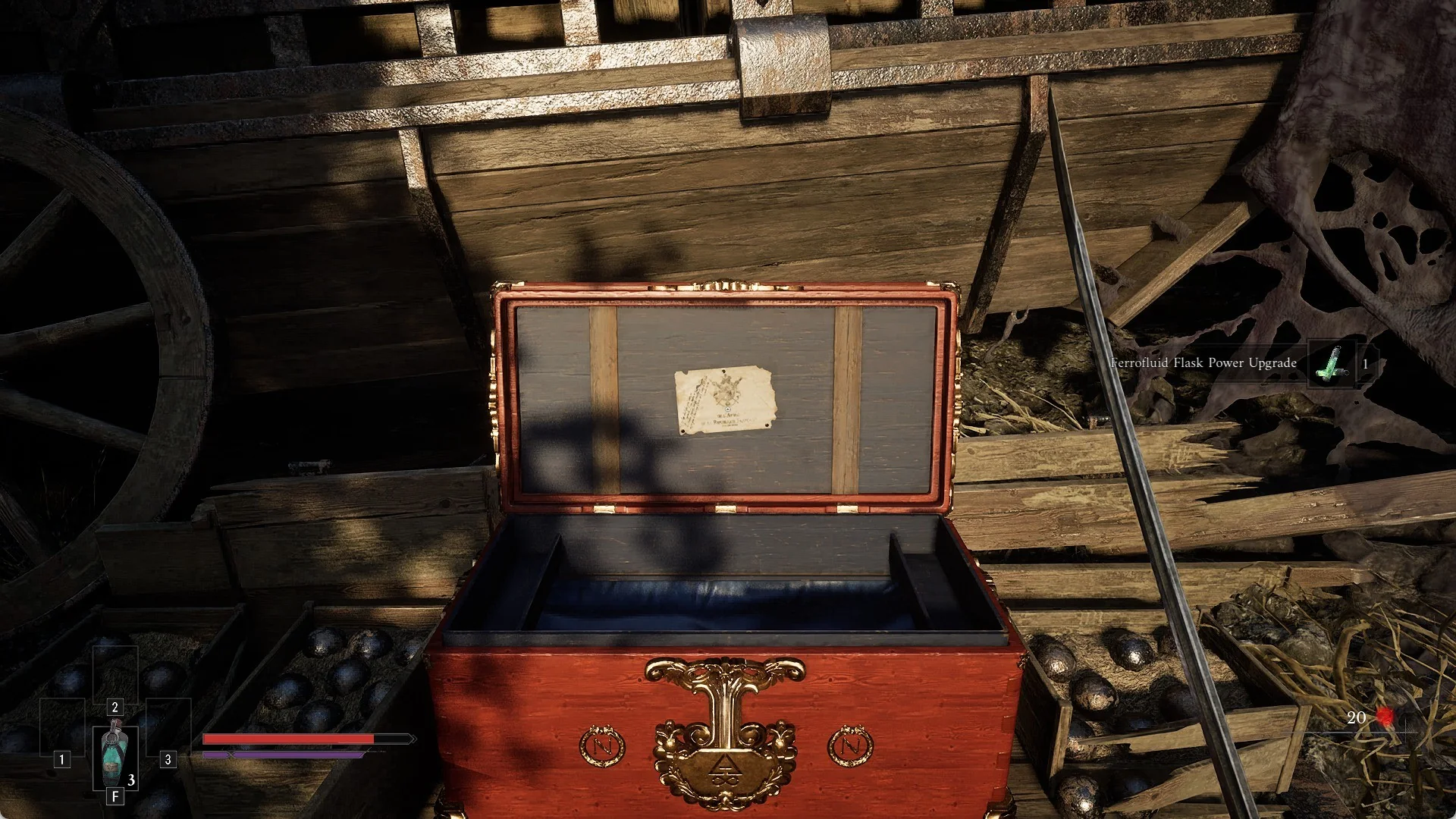 An open red chest beside a wagon in the Valley of Ashes with the Ferrofluid Flask Power Upgrade pickup banner