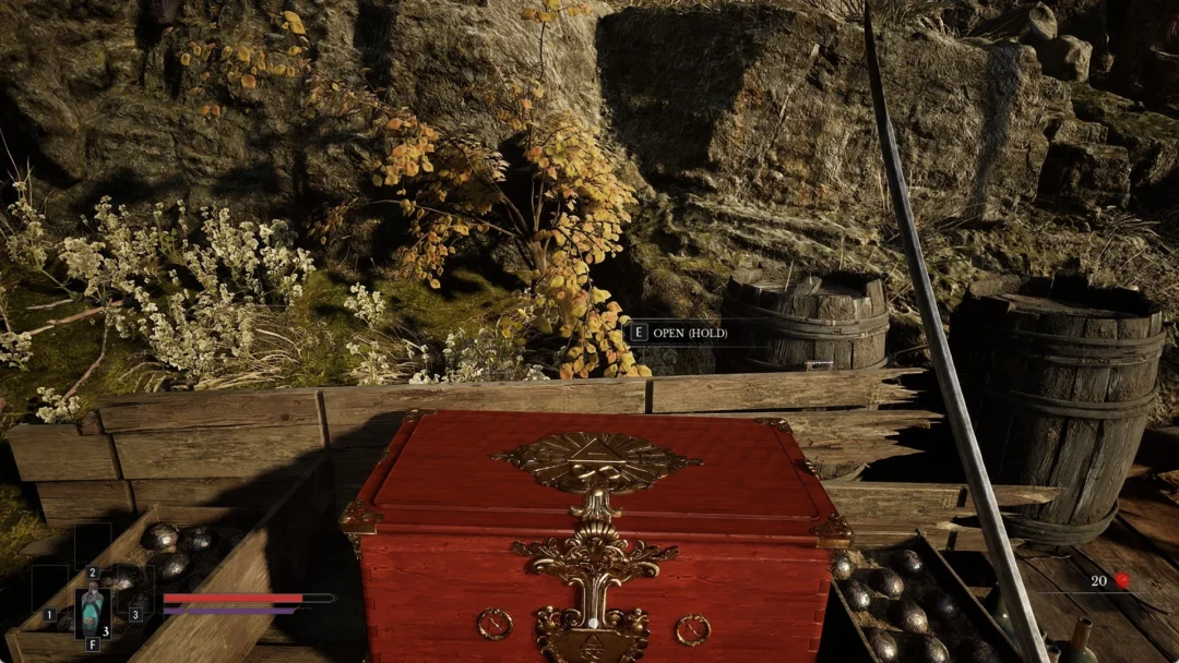 A red treasure chest on a wooden jetty in the Valley of Ashes with the OPEN (HOLD) prompt