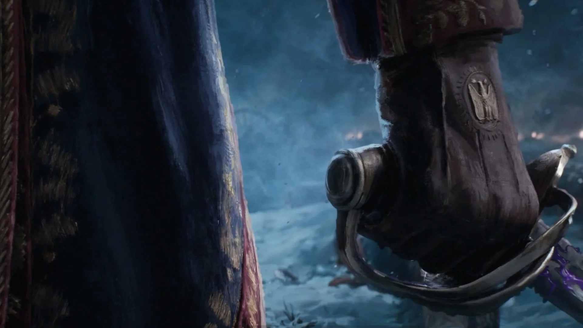 A sabre hilt in a gloved hand in the snow, from the Valor Mortis opening cinematic