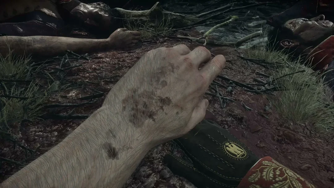 First-person view of a soldier's hands pressed into the mud among the fallen on the Valor Mortis battlefield