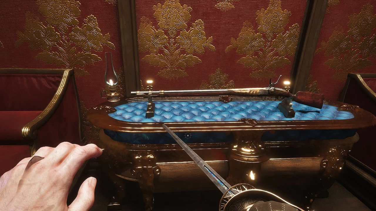 The Musket resting on two stands across a blue tufted display case in the red-wallpapered room