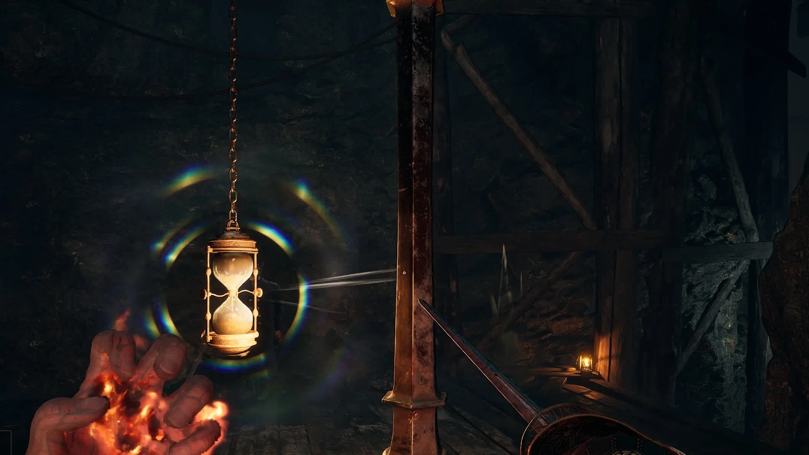 The Old Mine Lantern, an hourglass hanging from a post beside a plank walkway in a mine gallery