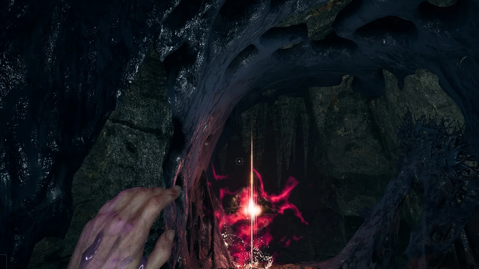 A red pillar of light rising from the floor of a mine tunnel, marking dropped Catalysts