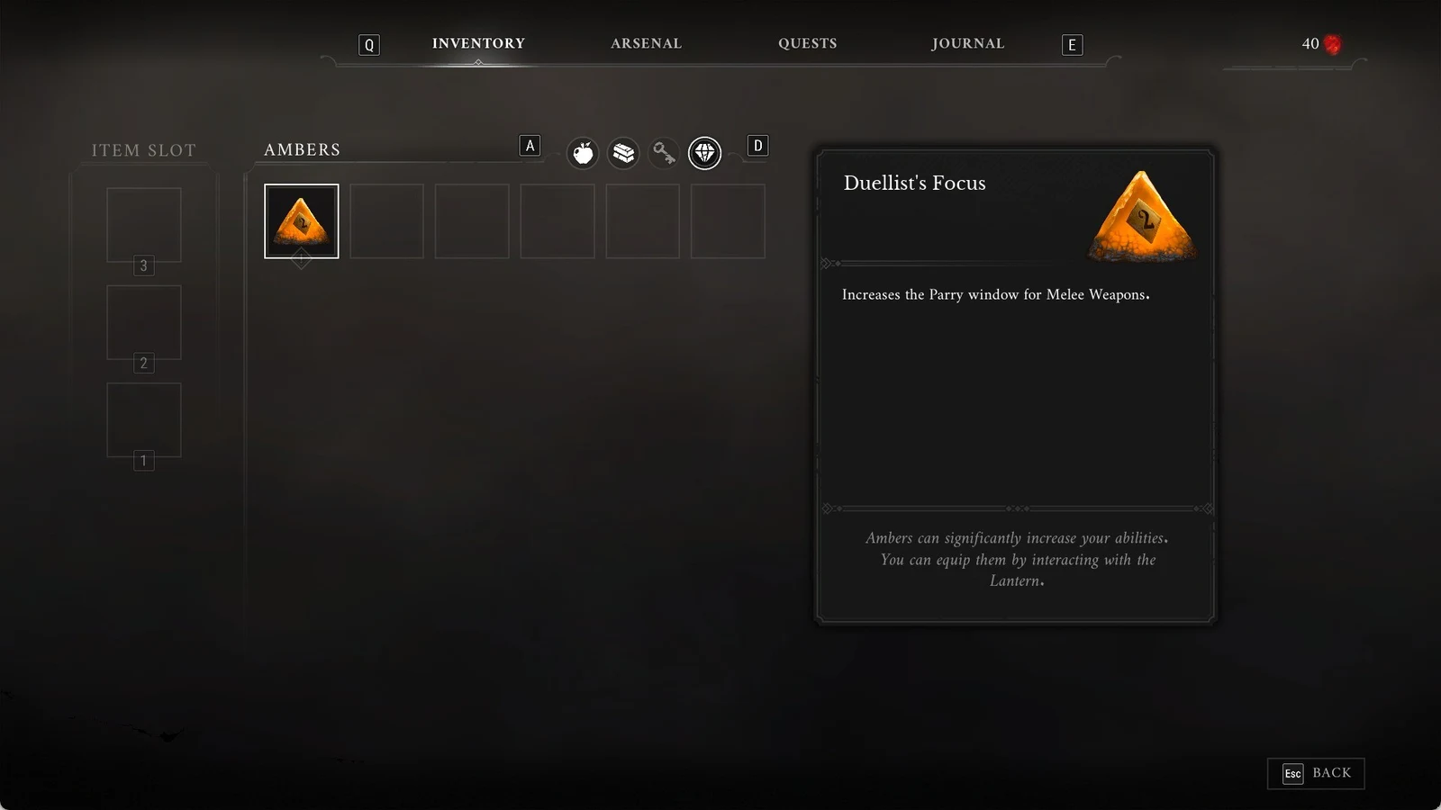 Inventory menu on the Ambers tab with Duellist's Focus selected, an orange pyramid amber, and its description panel.