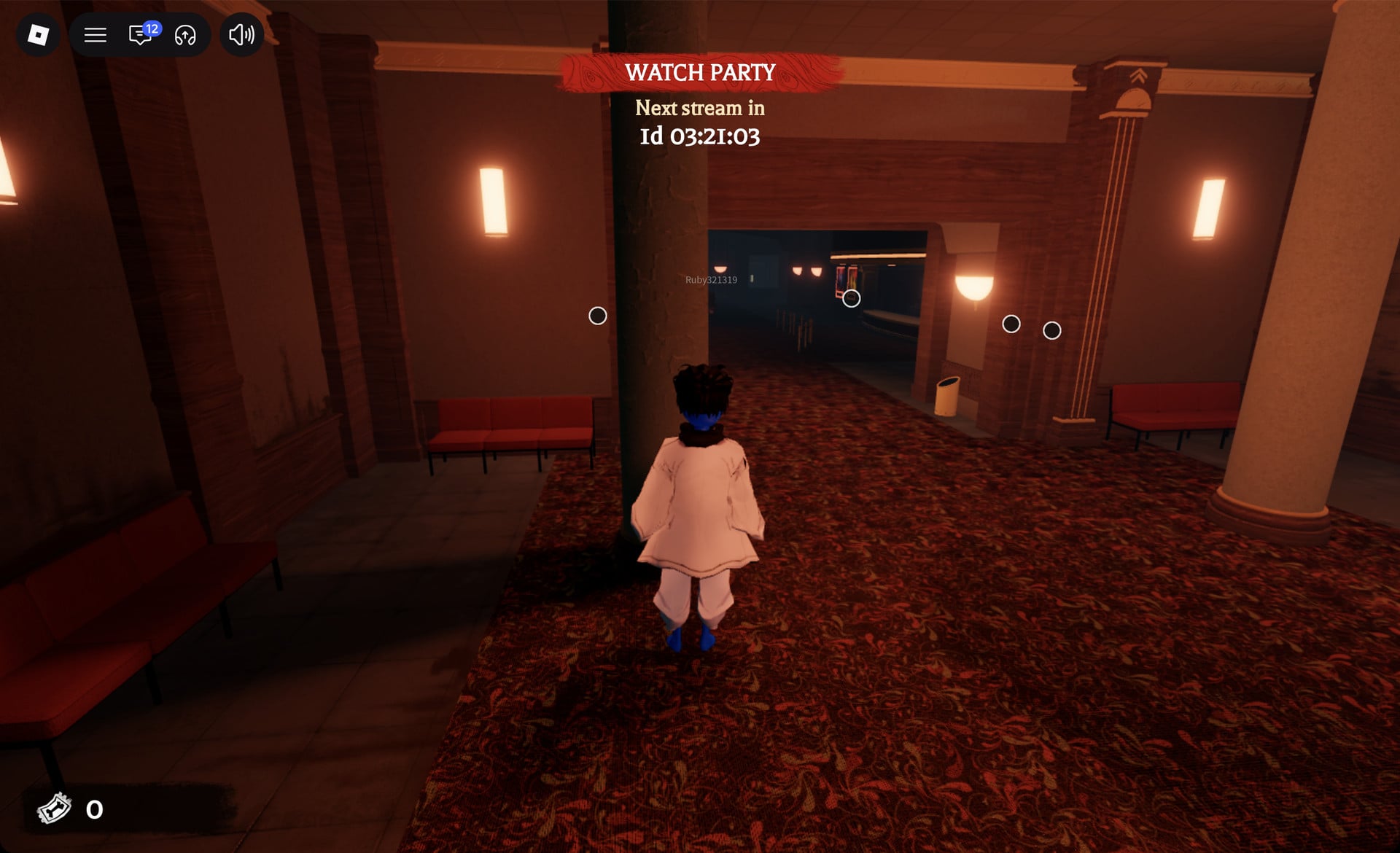 Avatar just inside The Hollow's cinema lobby on the carpet hall, red benches on the left