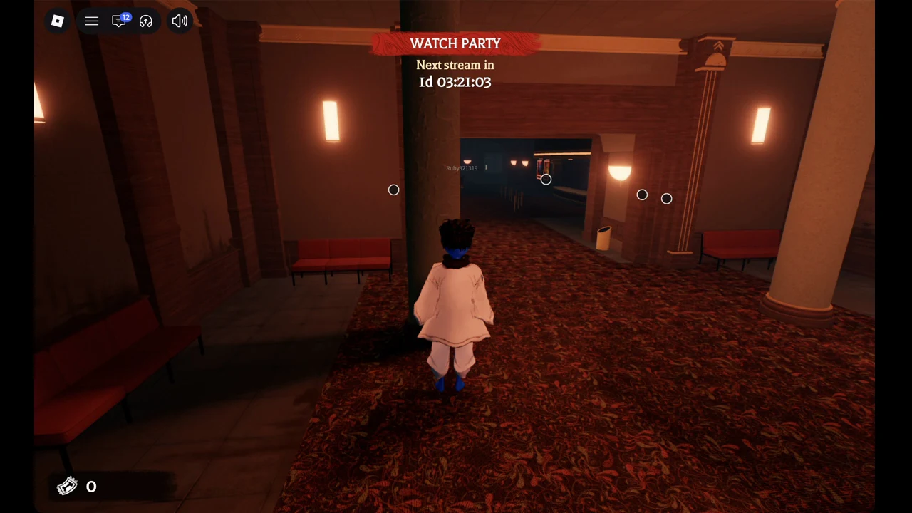 Avatar just inside The Hollow's cinema lobby on the carpet hall, red benches on the left