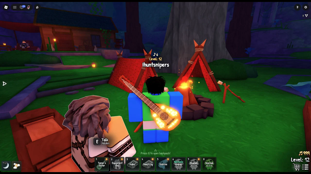The E Talk Halden prompt appears over Halden at the campfire between two red tents